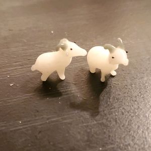 2 glass figurines mountain goats